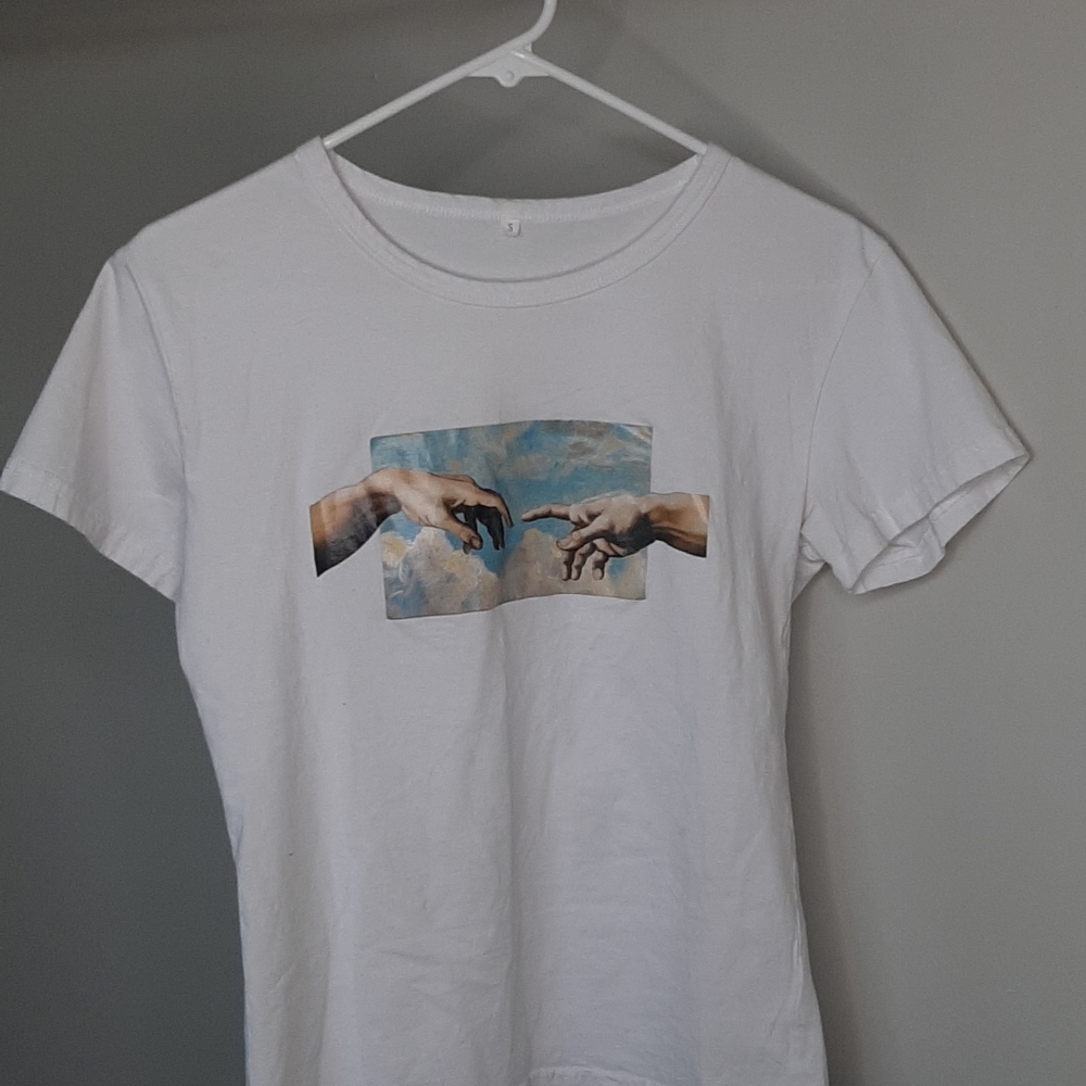 White graphic tee, how man was created